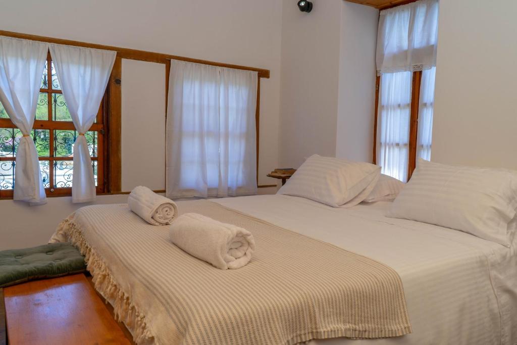Postel nebo postele na pokoji v ubytování Belaj's House