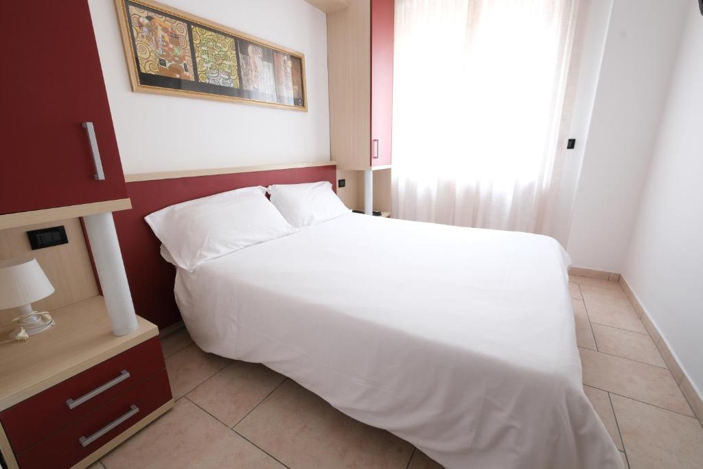 Postel nebo postele na pokoji v ubytování Hotel Nuovo Metrò
