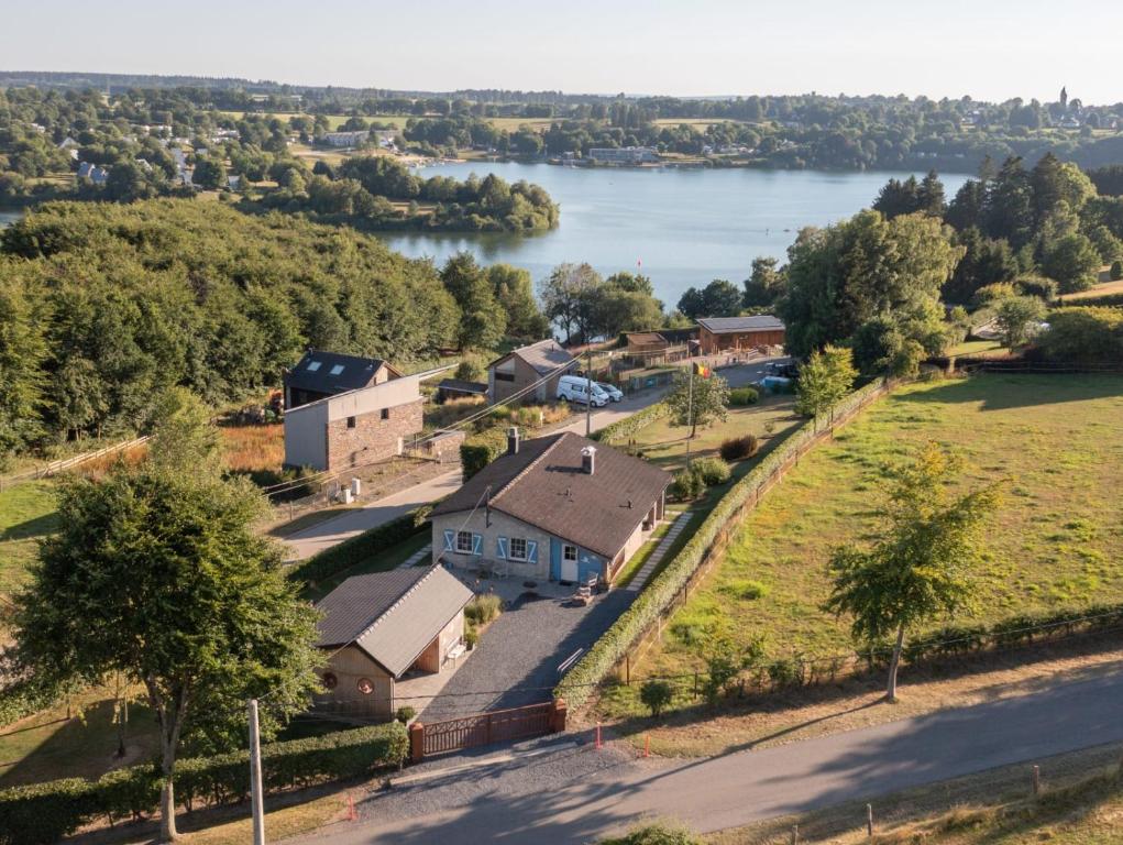 an aerial view of a house next to a lake at LAC ACHETTE AU LAC in Butgenbach