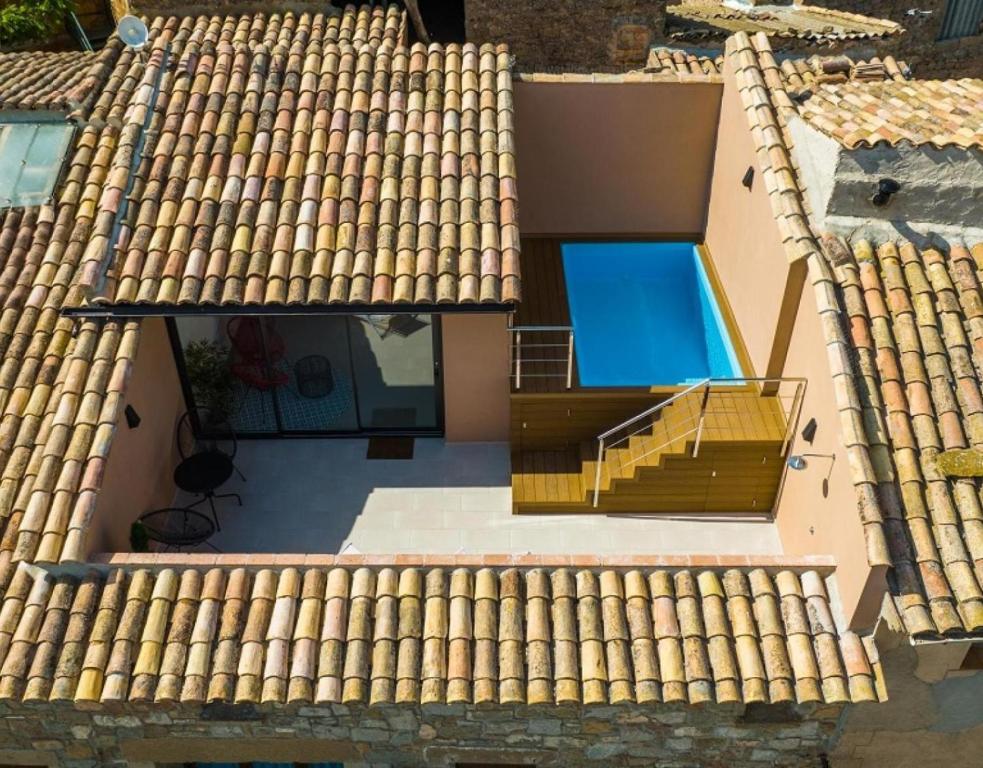 an overhead view of a roof with a swimming pool at Cal Comorera in Masoteras