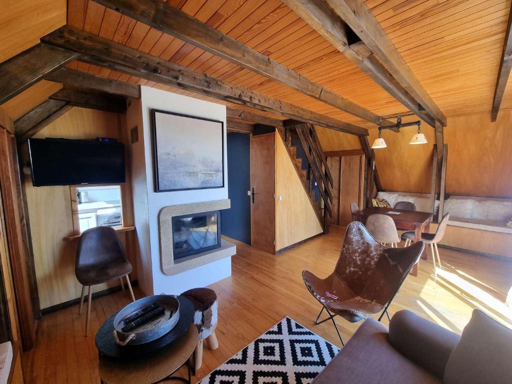 a living room with a couch and a fireplace at Chalet Saint-Michel-de-Chaillol, 4 pièces, 6 personnes - FR-1-393-159 in Saint-Michel-de-Chaillol