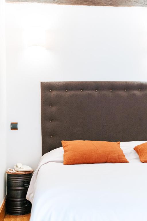 Postel nebo postele na pokoji v ubytování Hotel des Consuls