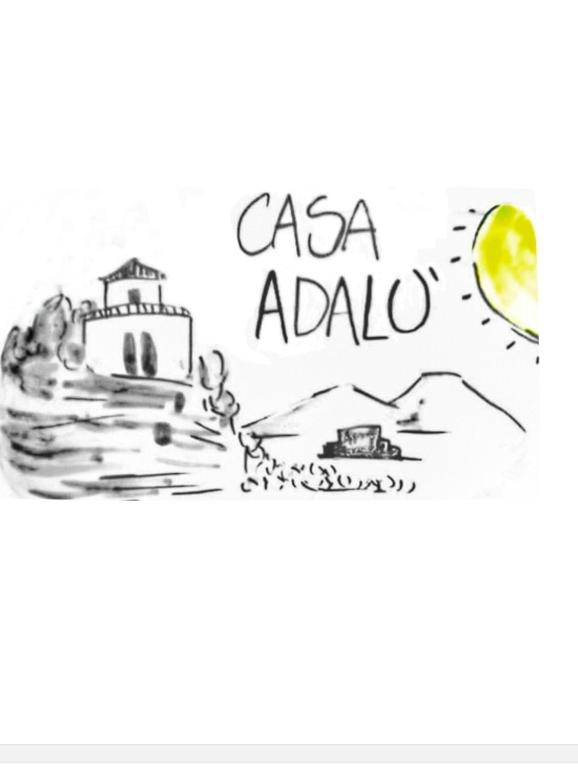 Black and white sketch of a house on a hill with mountains and a yellow sun, text reads Casa Adalù