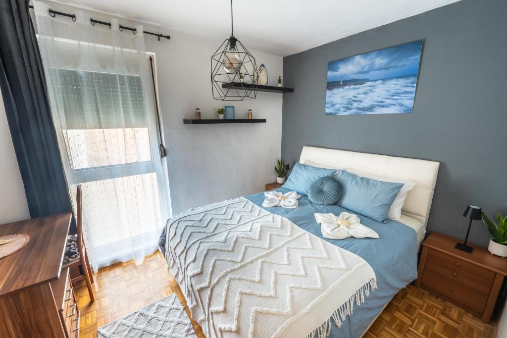 a bedroom with a bed with flowers on it at Apartment Vita in Izola