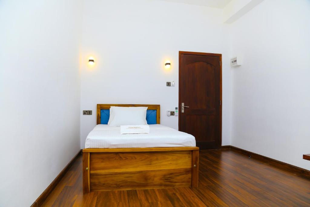 Postel nebo postele na pokoji v ubytování CROWN REGENCY- BADULLA