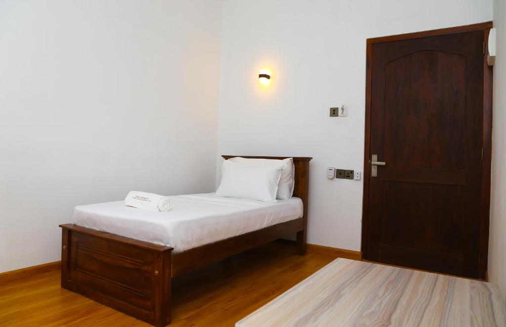 Postel nebo postele na pokoji v ubytování CROWN REGENCY- BADULLA