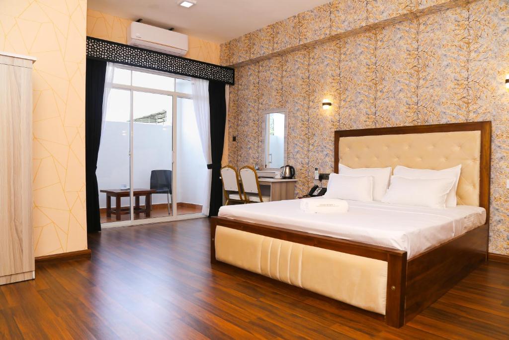 Postel nebo postele na pokoji v ubytování CROWN REGENCY- BADULLA