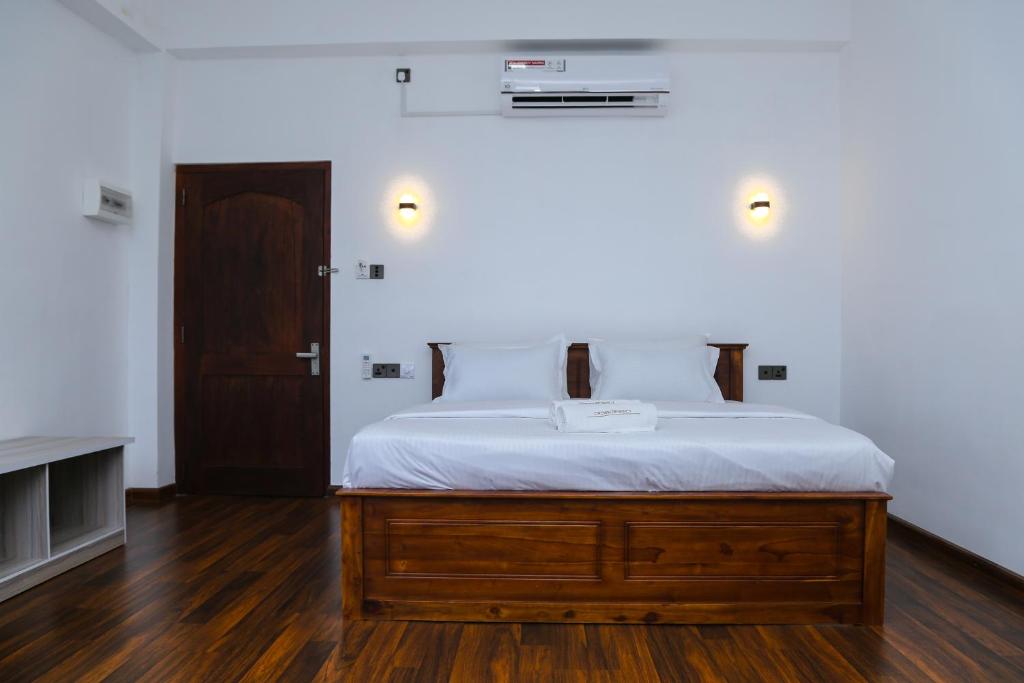 Postel nebo postele na pokoji v ubytování CROWN REGENCY- BADULLA