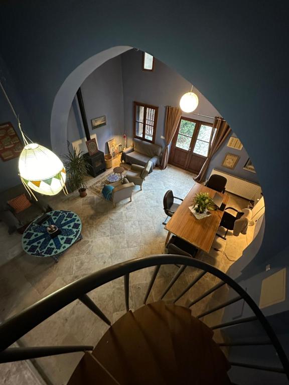 an overhead view of a living room with a table at Teleport Coliving Cyprus in Pano Lefkara