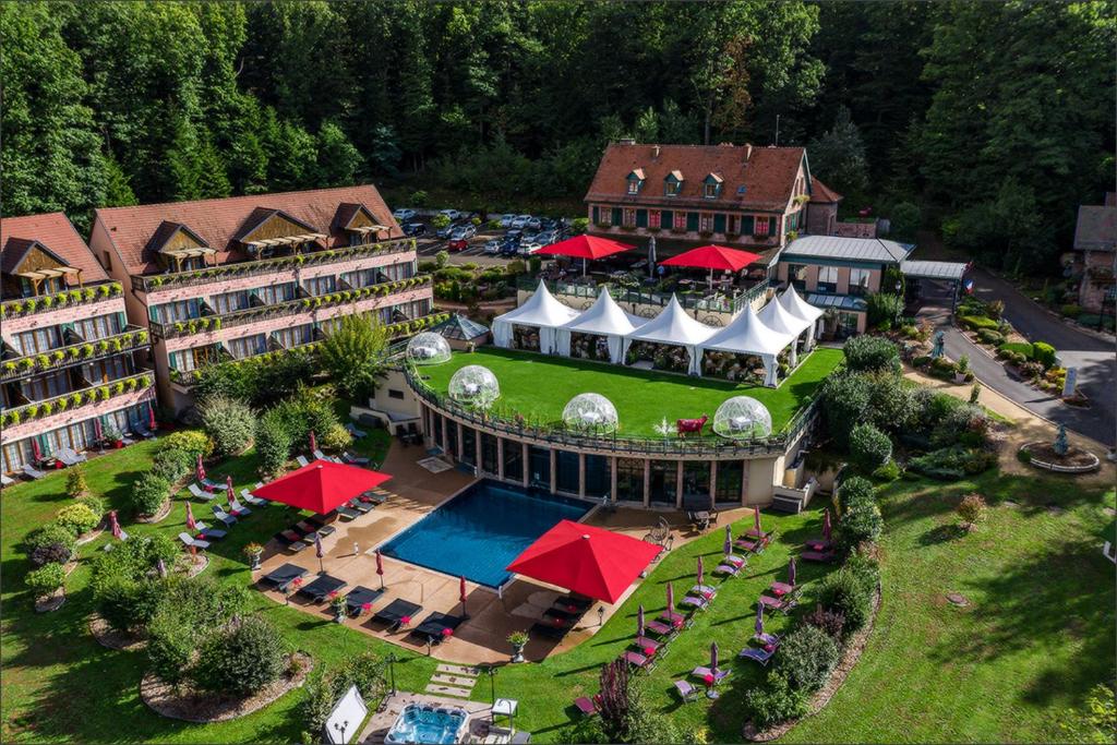 an aerial view of a hotel with a resort at Les Violettes Hotel & Spa in Jungholtz