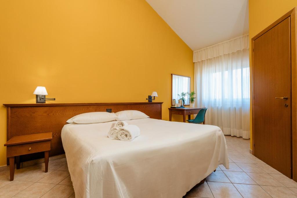 Postel nebo postele na pokoji v ubytování Hotel Altevie