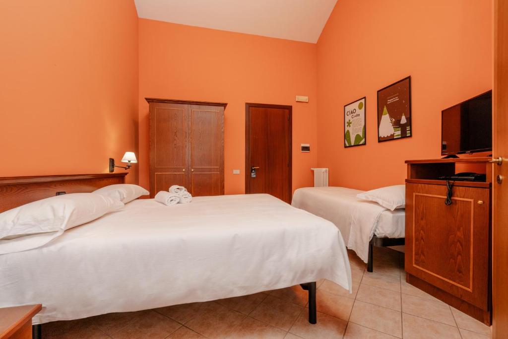 Postel nebo postele na pokoji v ubytování Hotel Altevie