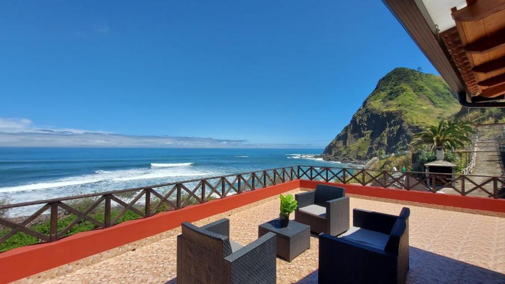 a view of the ocean from a hotel balcony at Maiata Beach House by HR Madeira in Porto da Cruz