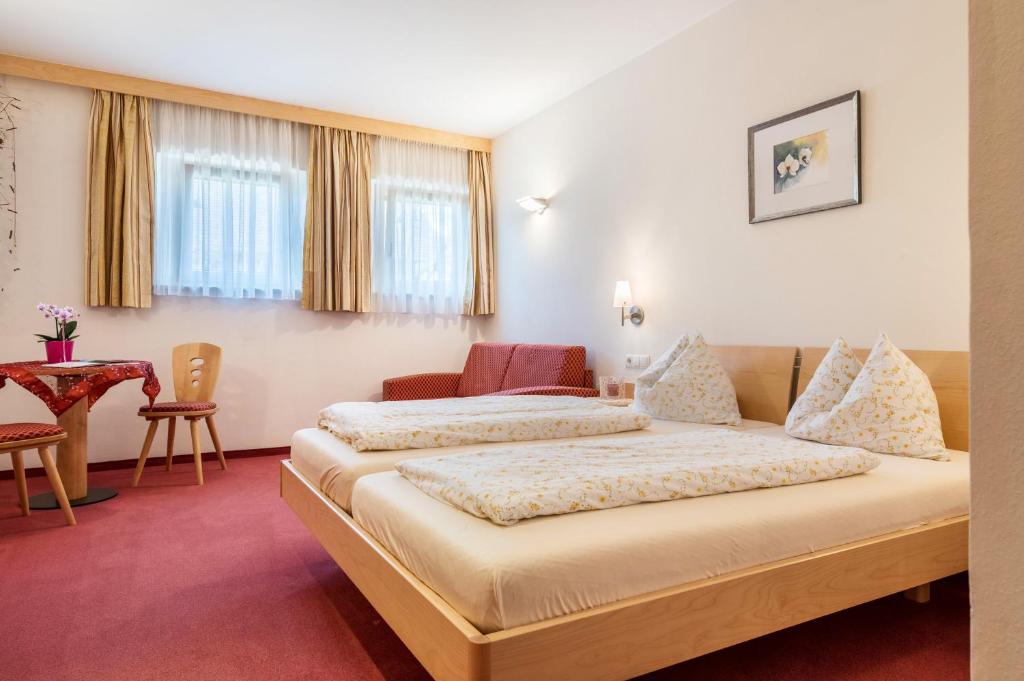 Postel nebo postele na pokoji v ubytování Haus Rosengarten Apt A