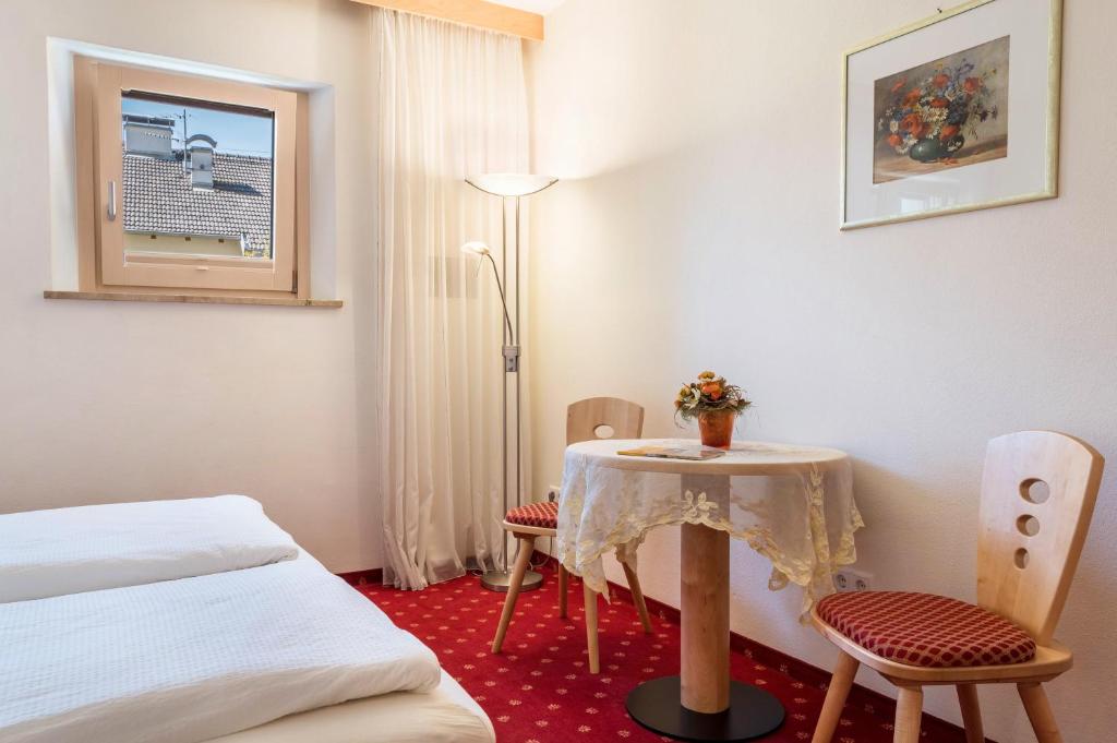Postel nebo postele na pokoji v ubytování Haus Rosengarten Apt A