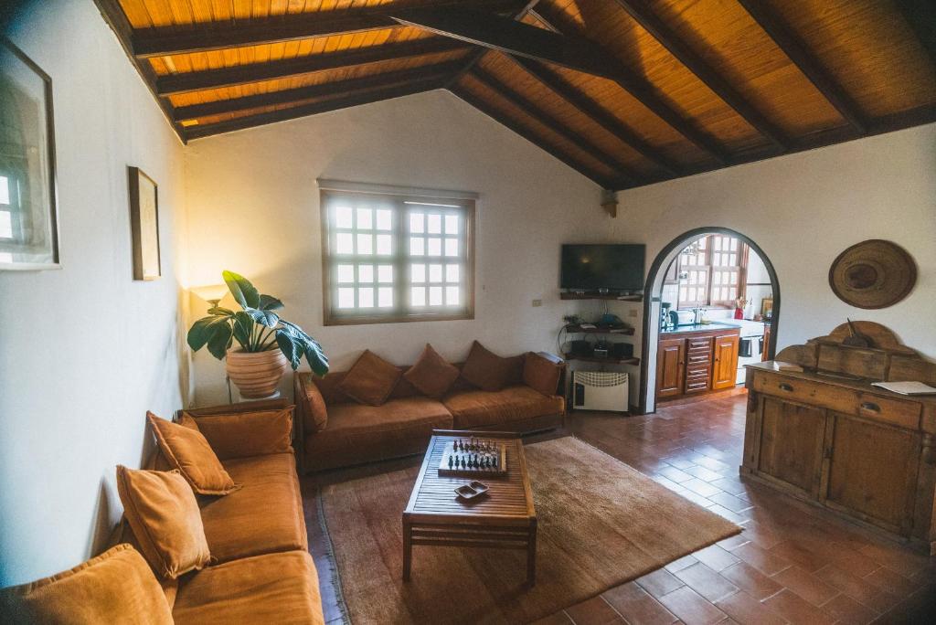 a living room with a couch and a table at Casa Muna in El Cercado