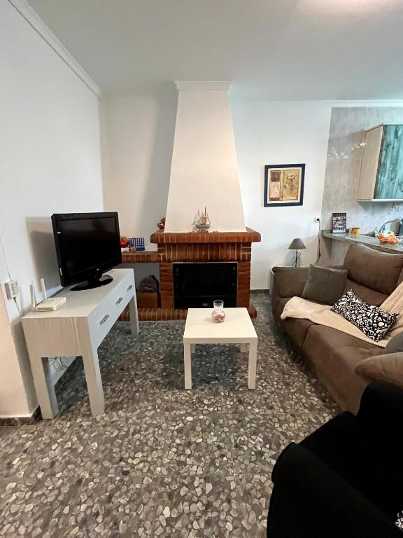 Televízia a/alebo spoločenská miestnosť v ubytovaní Apartamentos "Un Rico Domingo", Parking solo planta baja