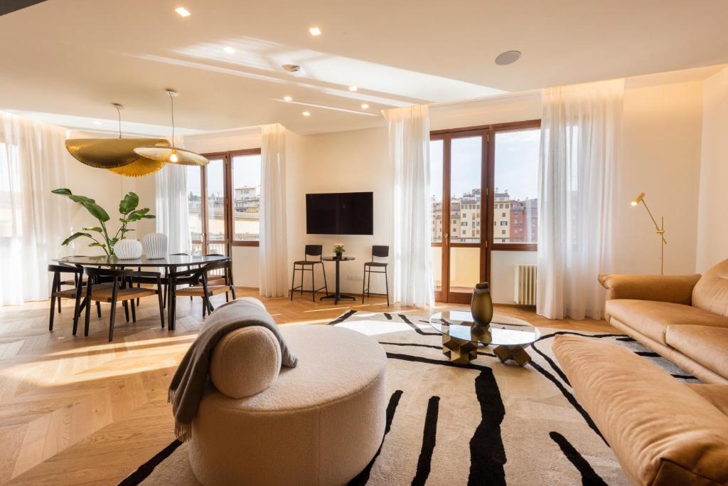 a living room with a couch and a table at Oro1 Florence Luxury Apartment by Mmega in Florence