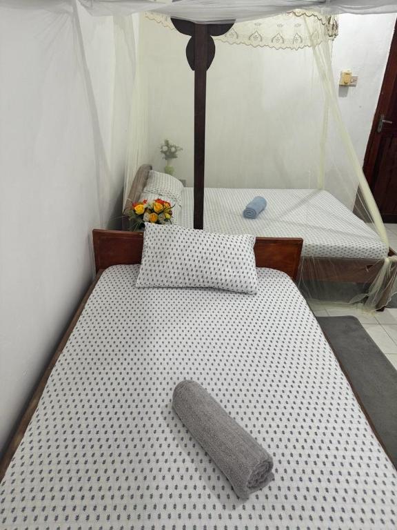 Postel nebo postele na pokoji v ubytování Sanaa Hostel