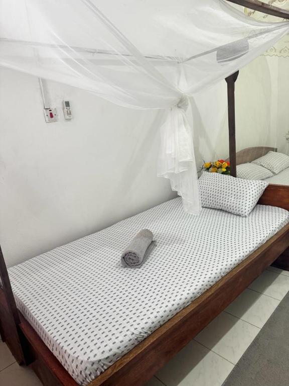 Postel nebo postele na pokoji v ubytování Sanaa Hostel