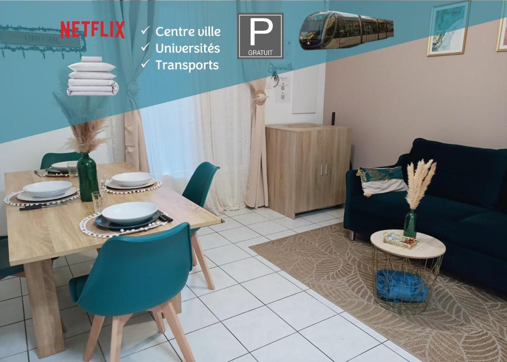 uma sala de estar com uma mesa e um sofá azul em Kedge 9 - proche centre, tram & universités em Talence