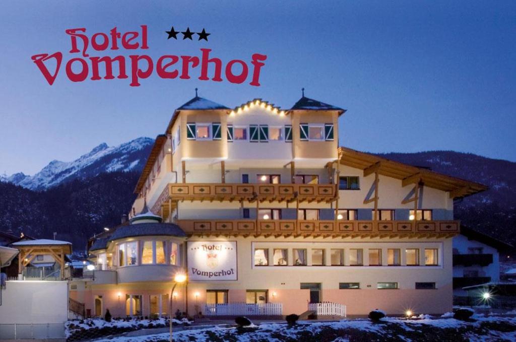 a building with a sign that reads hotel vermont at Hotel Vomperhof in Vomp