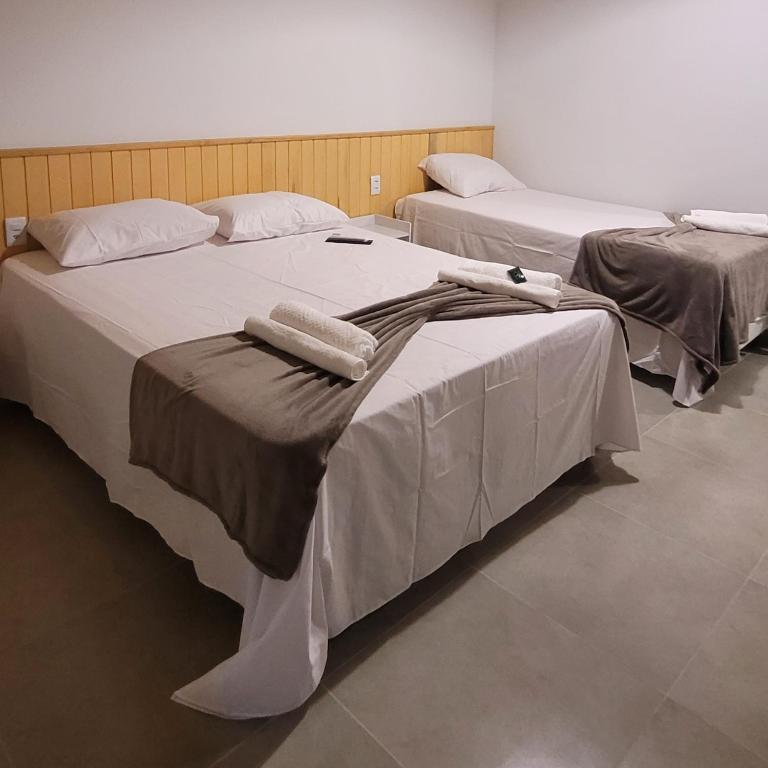 A bed or beds in a room at Pousada Angatu Jalapão