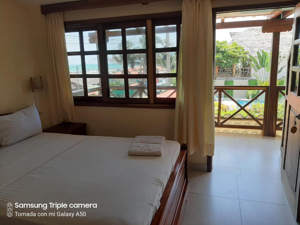 Postel nebo postele na pokoji v ubytování Hotel La Vista