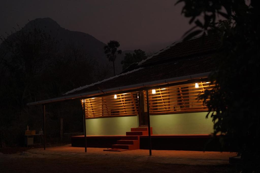 a building with lights on it at night at Greene Villa in Palakkad