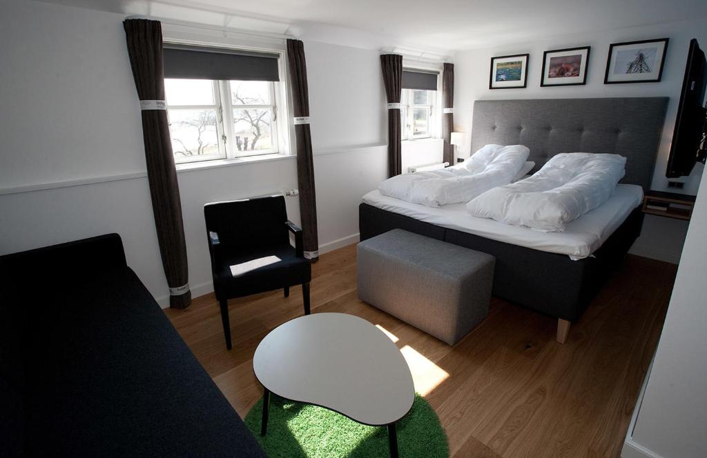 Postel nebo postele na pokoji v ubytování Hotel Kongensbro Kro