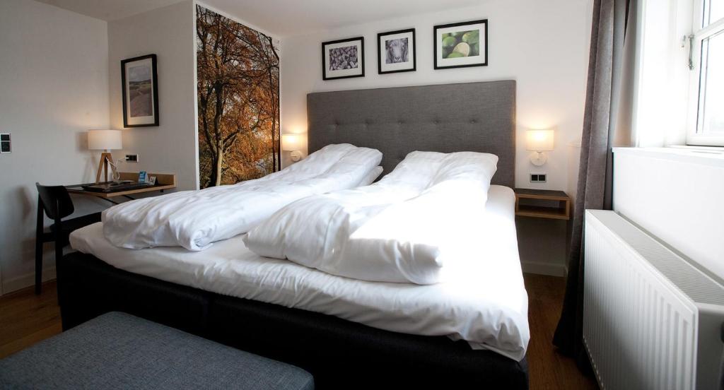 Postel nebo postele na pokoji v ubytování Hotel Kongensbro Kro