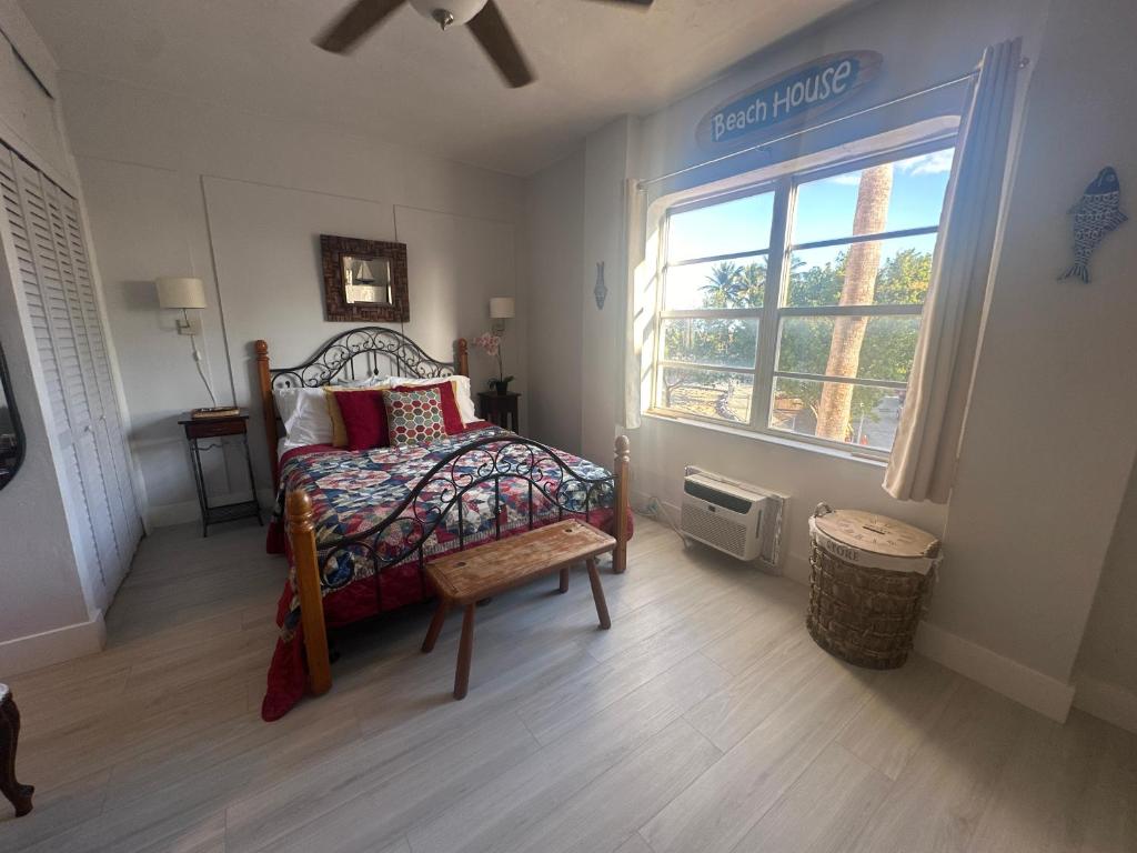 a bedroom with a bed and a window at Dream Studio on the Beach in Miami Beach