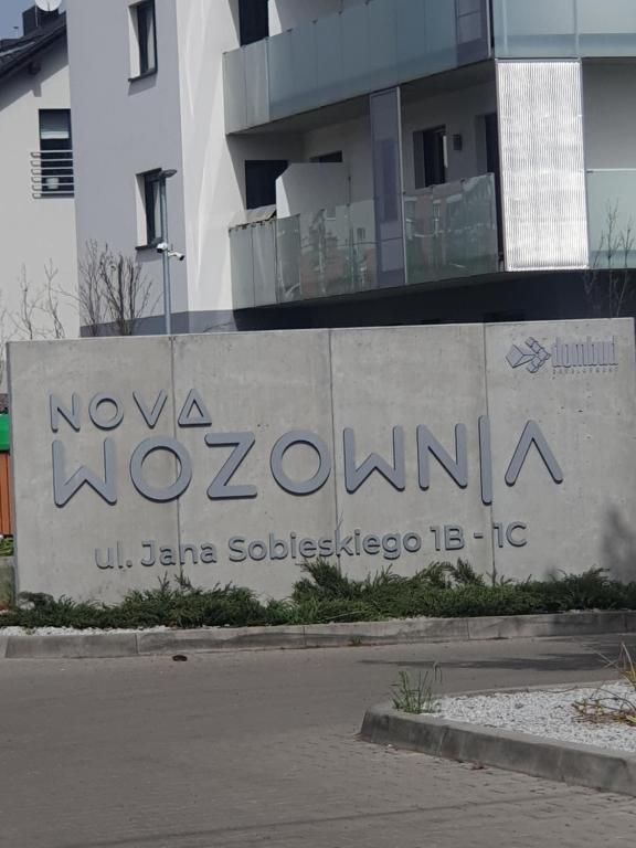 a building with a sign that reads nova vacuum at Apartament Number 2 NOVA WOZOWNIA Free Parking in Leszno