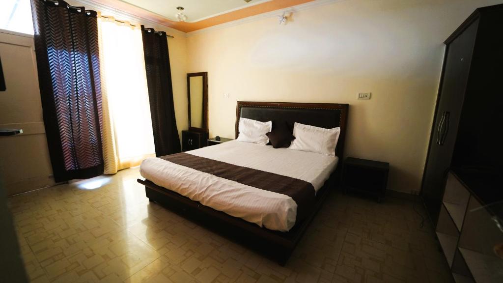 Hotel Star View tesisinde bir odada yatak veya yataklar
