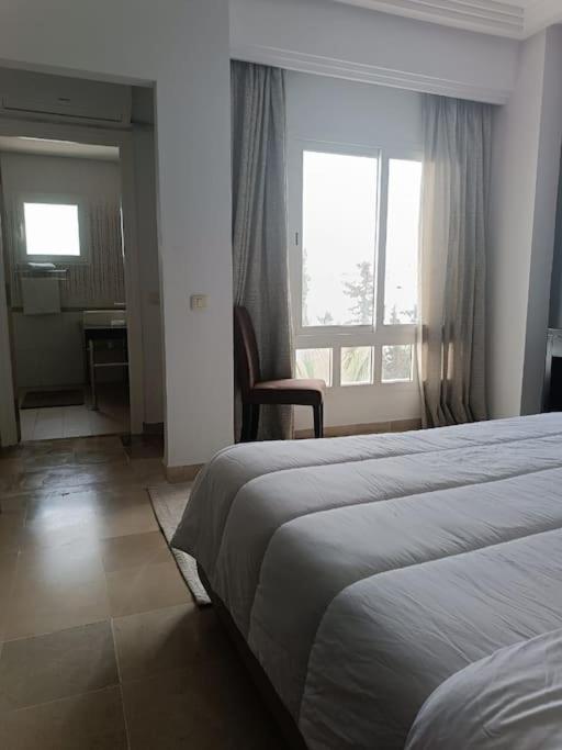 Un ou plusieurs lits dans un hébergement de l'établissement Logement S+2 dans un hôtel 4* vue mer