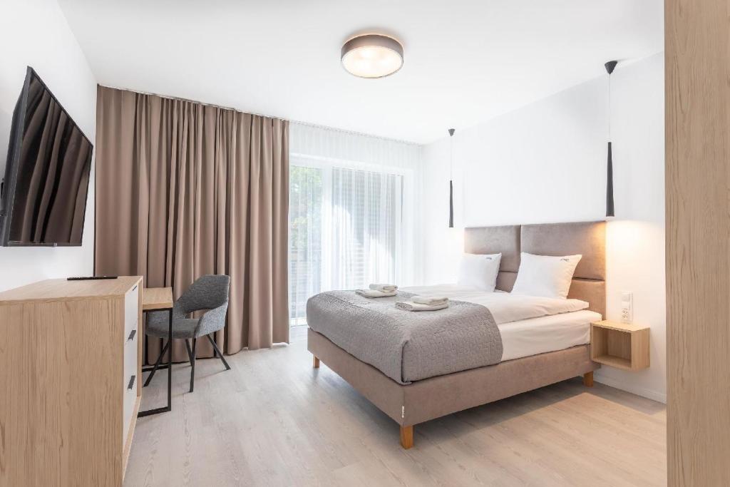 מיטה או מיטות בחדר ב-Ferienwohnung am Meer, Urlaub auf der Insel Usedom, Apartment Matejki 17