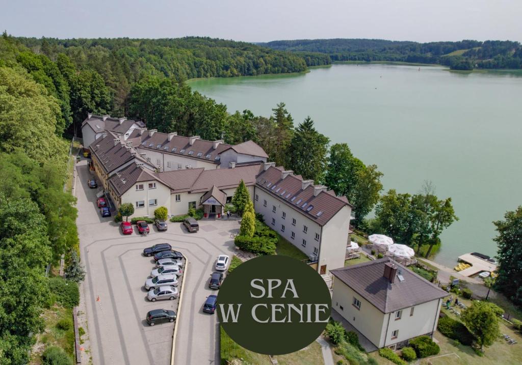 an aerial view of the spa w centre with a lake at Hotel Mazuria Country & SPA in Mrągowo