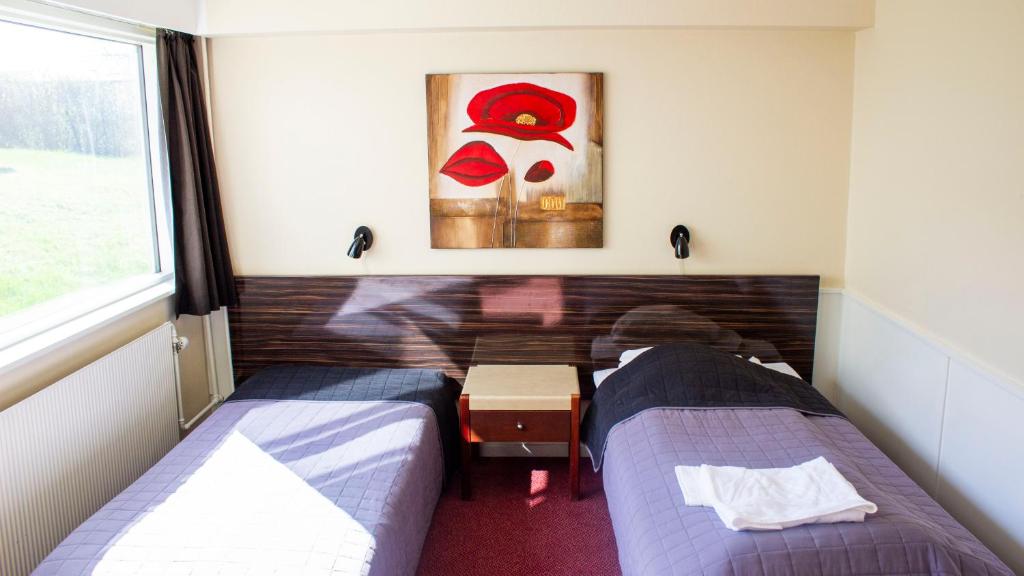 Postel nebo postele na pokoji v ubytování A Hotels Roskilde