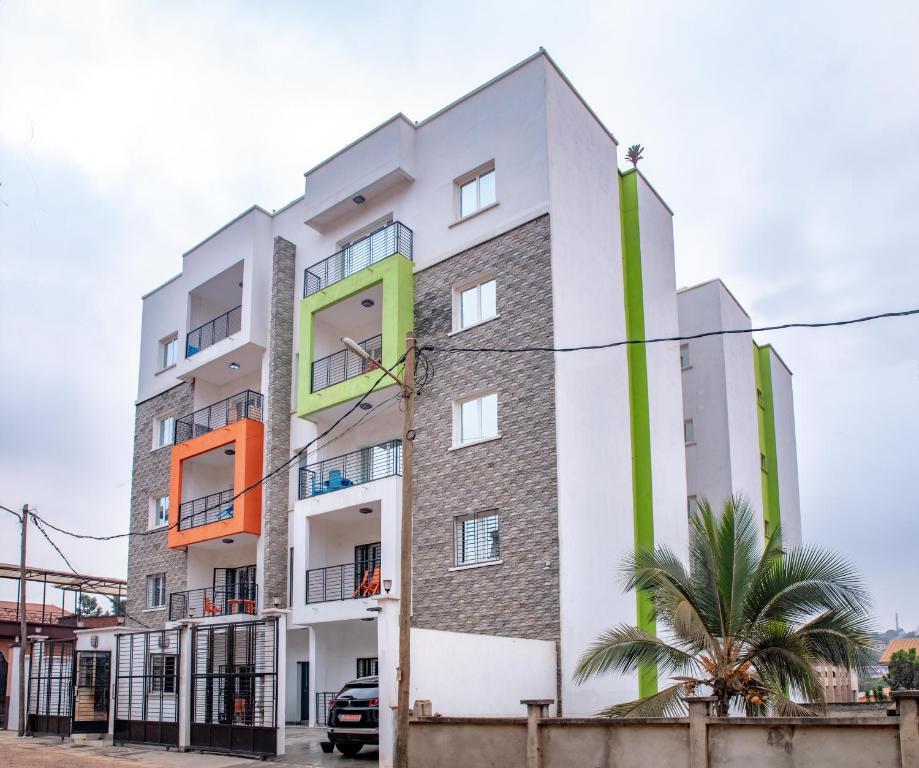 an apartment building with colorful windows at Bel appartement chambre Omnisport in Yaoundé