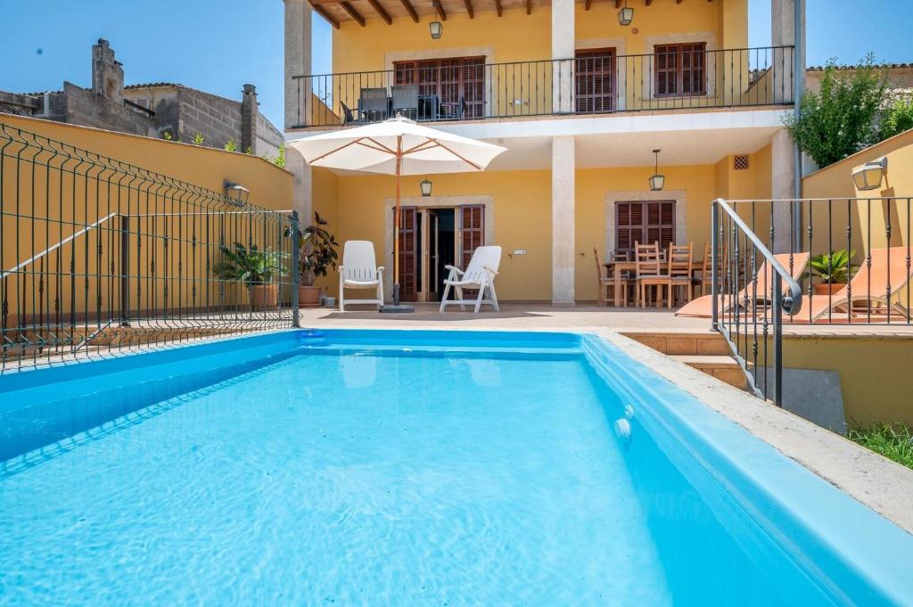 a villa with a swimming pool and a house at Ferienhaus mit Privatpool für 7 Personen ca 272 qm in Son Carrio, Mallorca Südostküste von Mallorca in Son Carrió