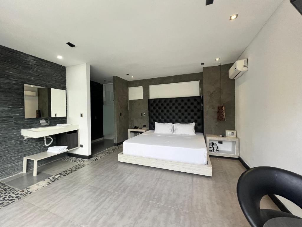 Postel nebo postele na pokoji v ubytování Hotel 47 Medellin Center