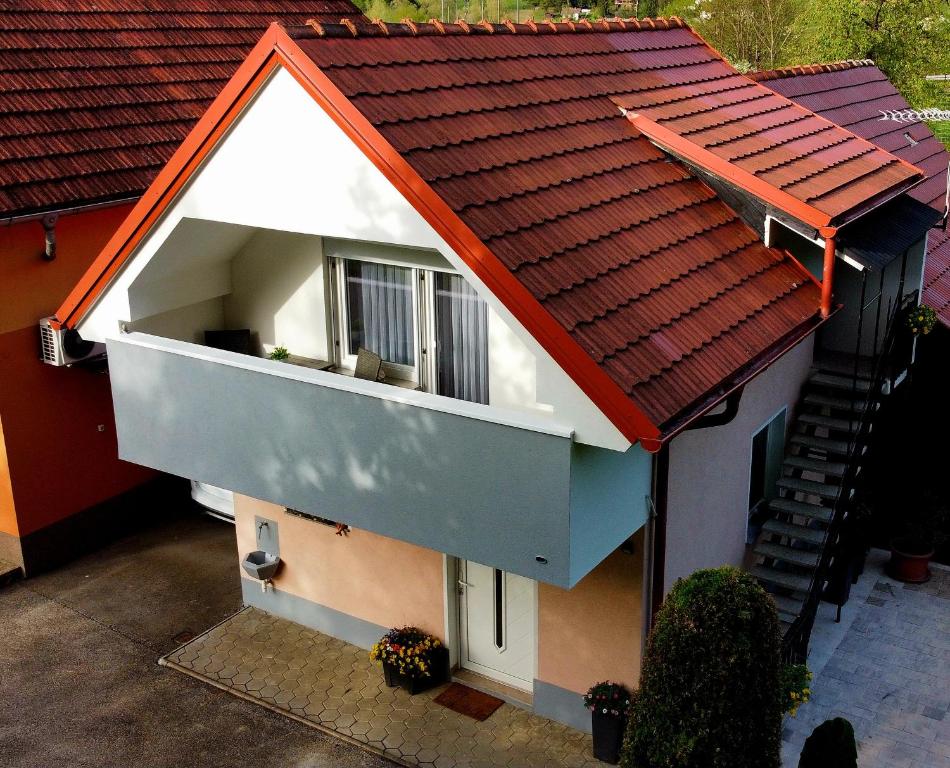 an overhead view of a house with an orange roof at Apartma Jurka in Podčetrtek