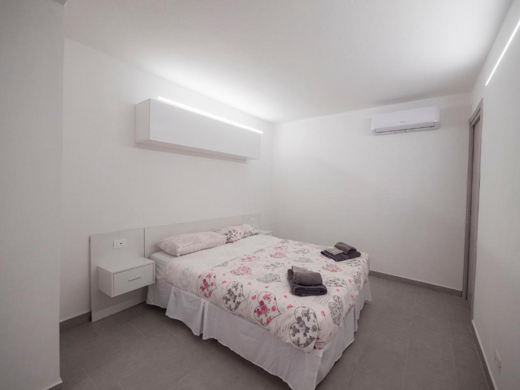 A bed or beds in a room at Villa Lisa casa vacanze