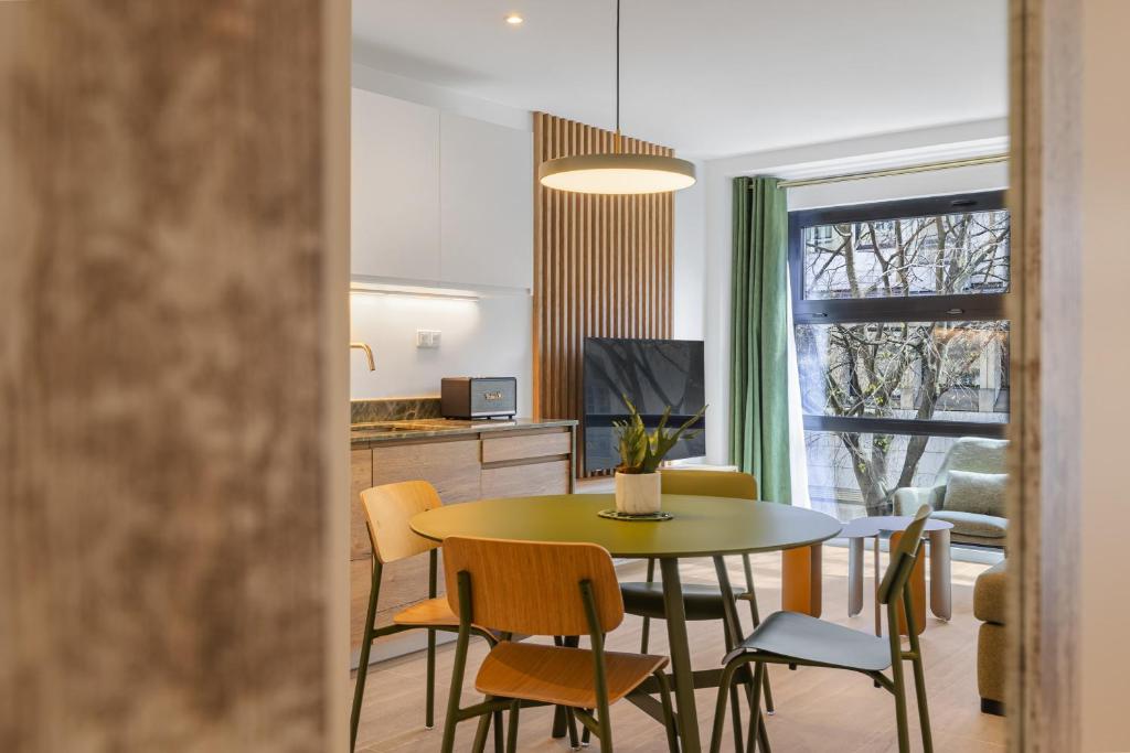 a kitchen and dining room with a table and chairs at Soubise in Paris