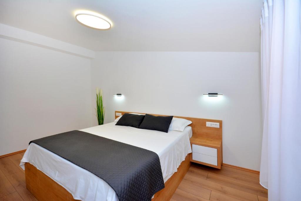 Posteľ alebo postele v izbe v ubytovaní Apartments Radeljić