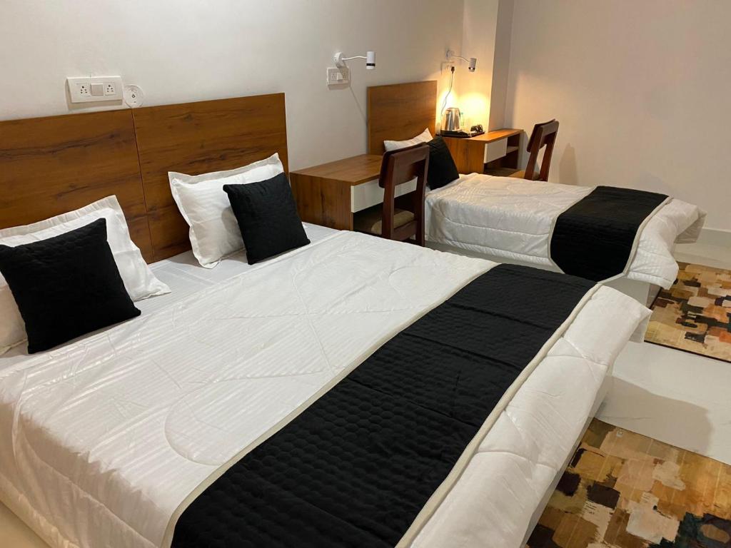 Postel nebo postele na pokoji v ubytování Royal Park Inn