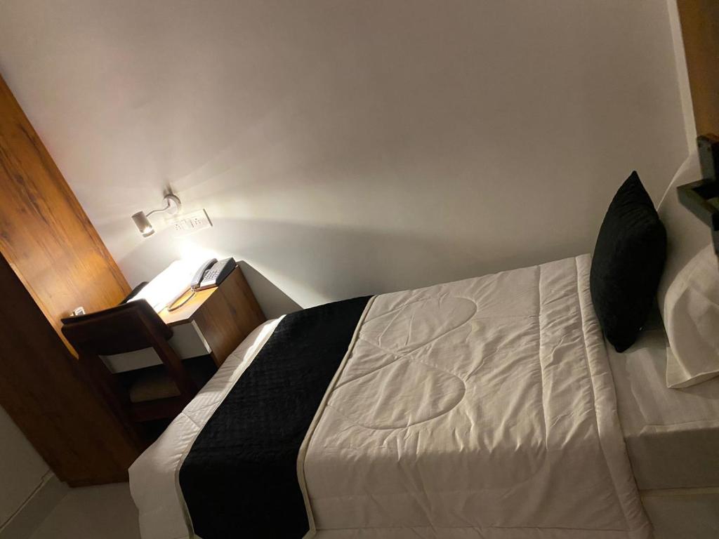Postel nebo postele na pokoji v ubytování Royal Park Inn