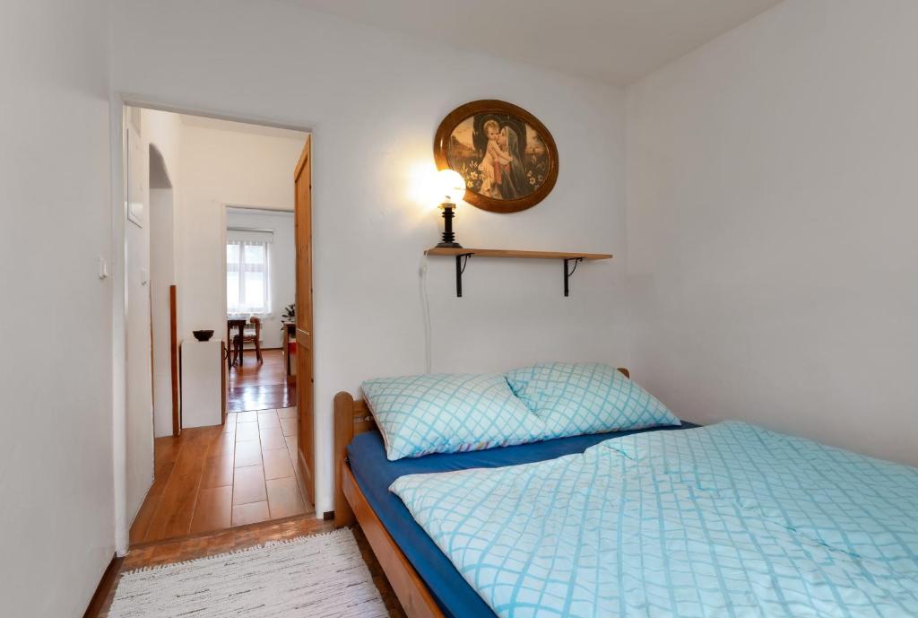 Postel nebo postele na pokoji v ubytování Apartmán Na náměstí