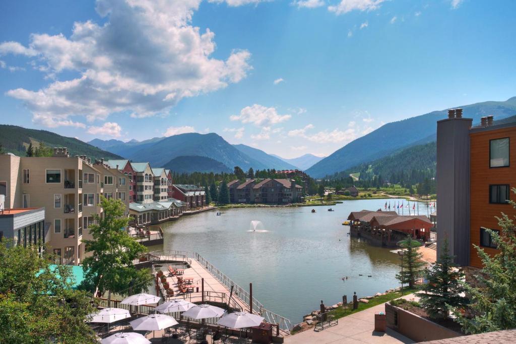a view of a river in a town with mountains at The Keystone Lodge and Spa by Keystone Resort in Keystone