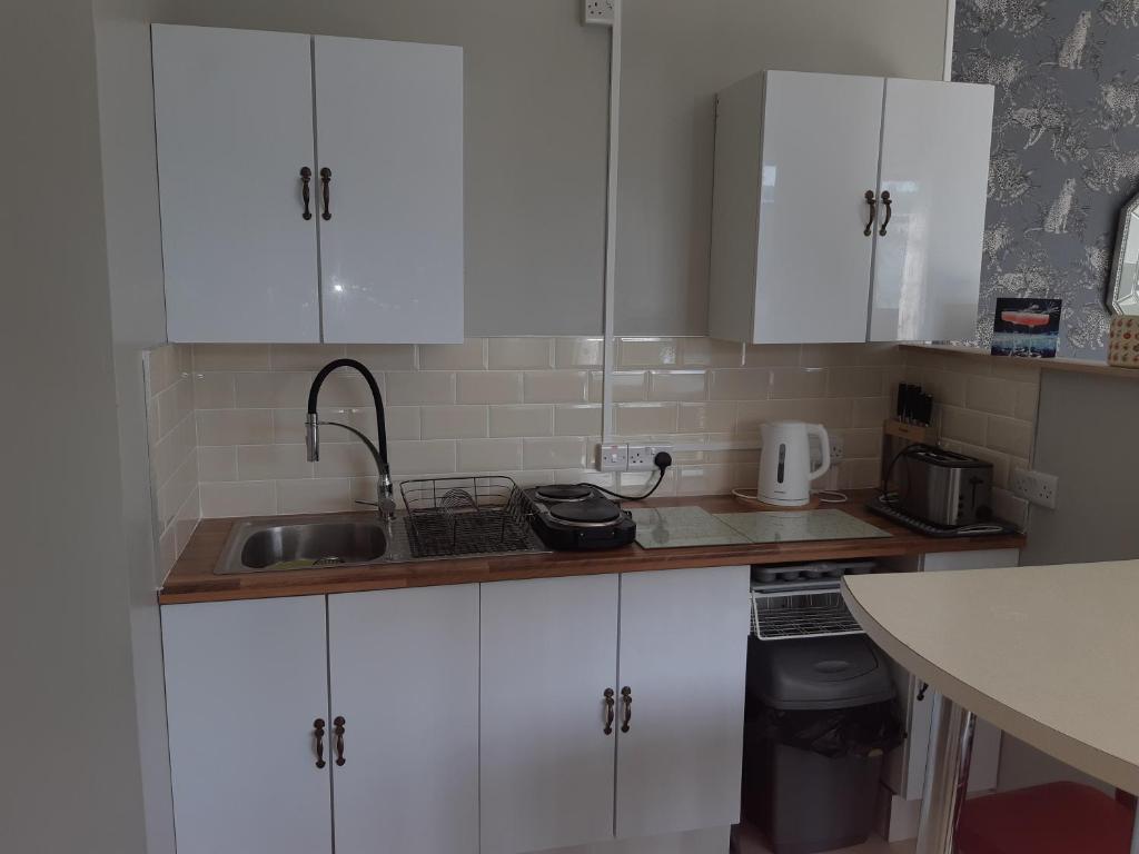 Kuchyň nebo kuchyňský kout v ubytování Haven Apartment